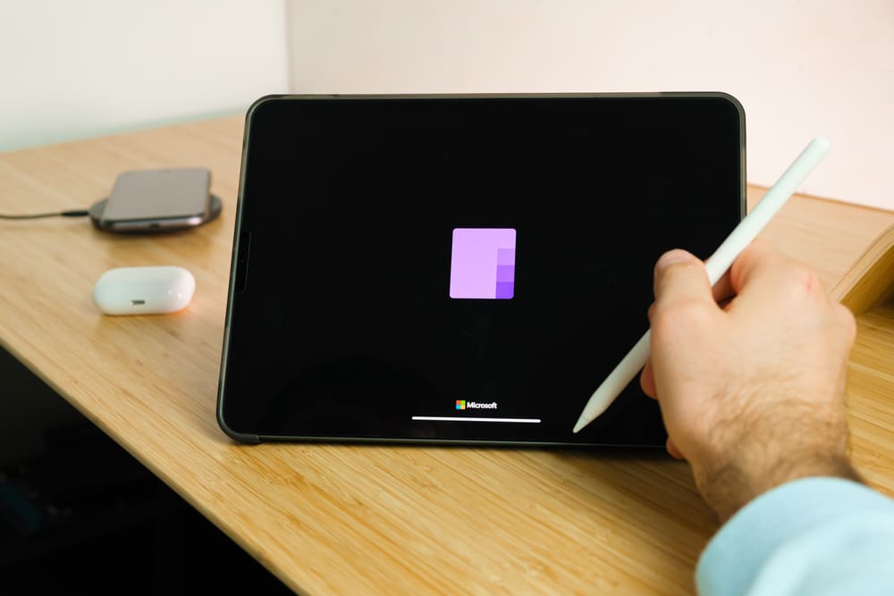 someone taking notes on tablet using Microsoft Office OneNote
